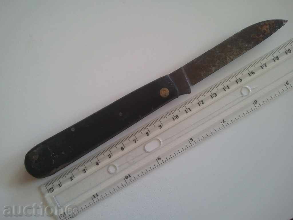 an old knife with a sickle and a hammer strong