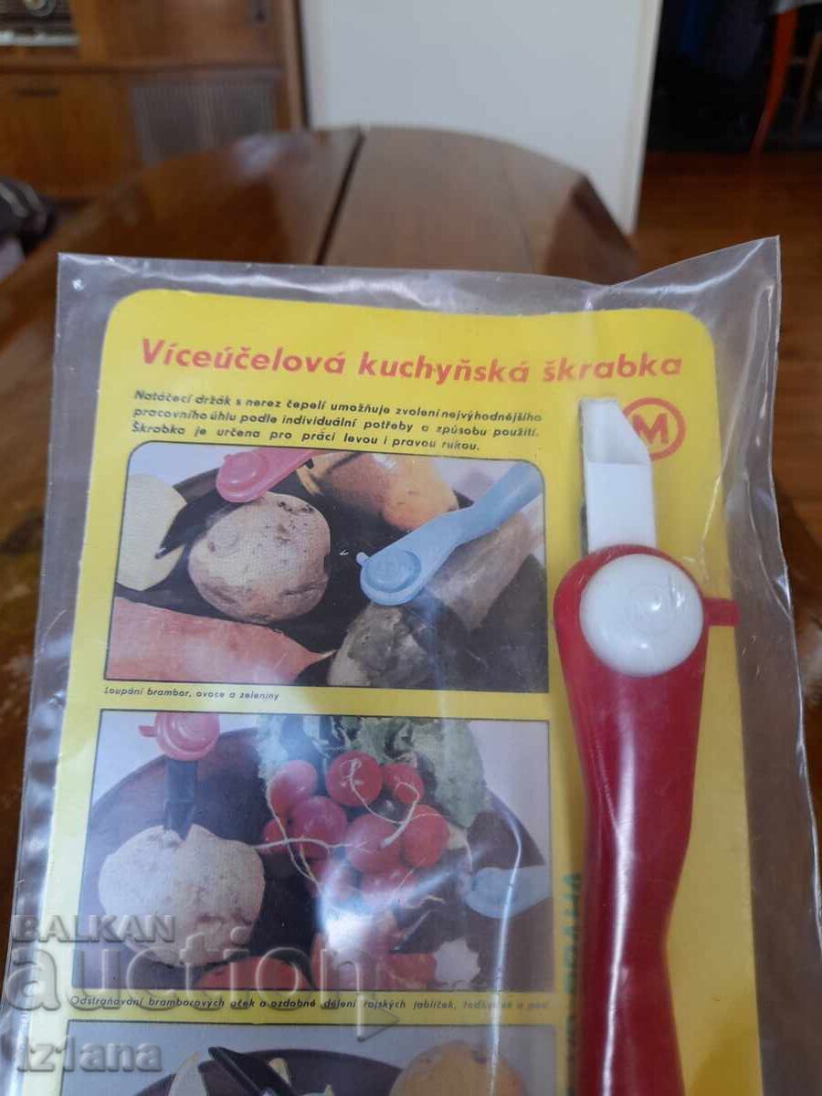 Livrarea Unealtă veche de bucătărie pentru curățat, decojitor Livrarea Unealtă veche de bucătărie pentru curățat, decojitor