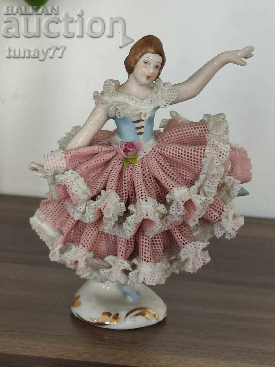 Vintage porcelain figurine of a girl with marking
