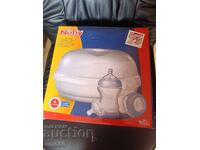 Nuby steam sterilizer + 2 bottles