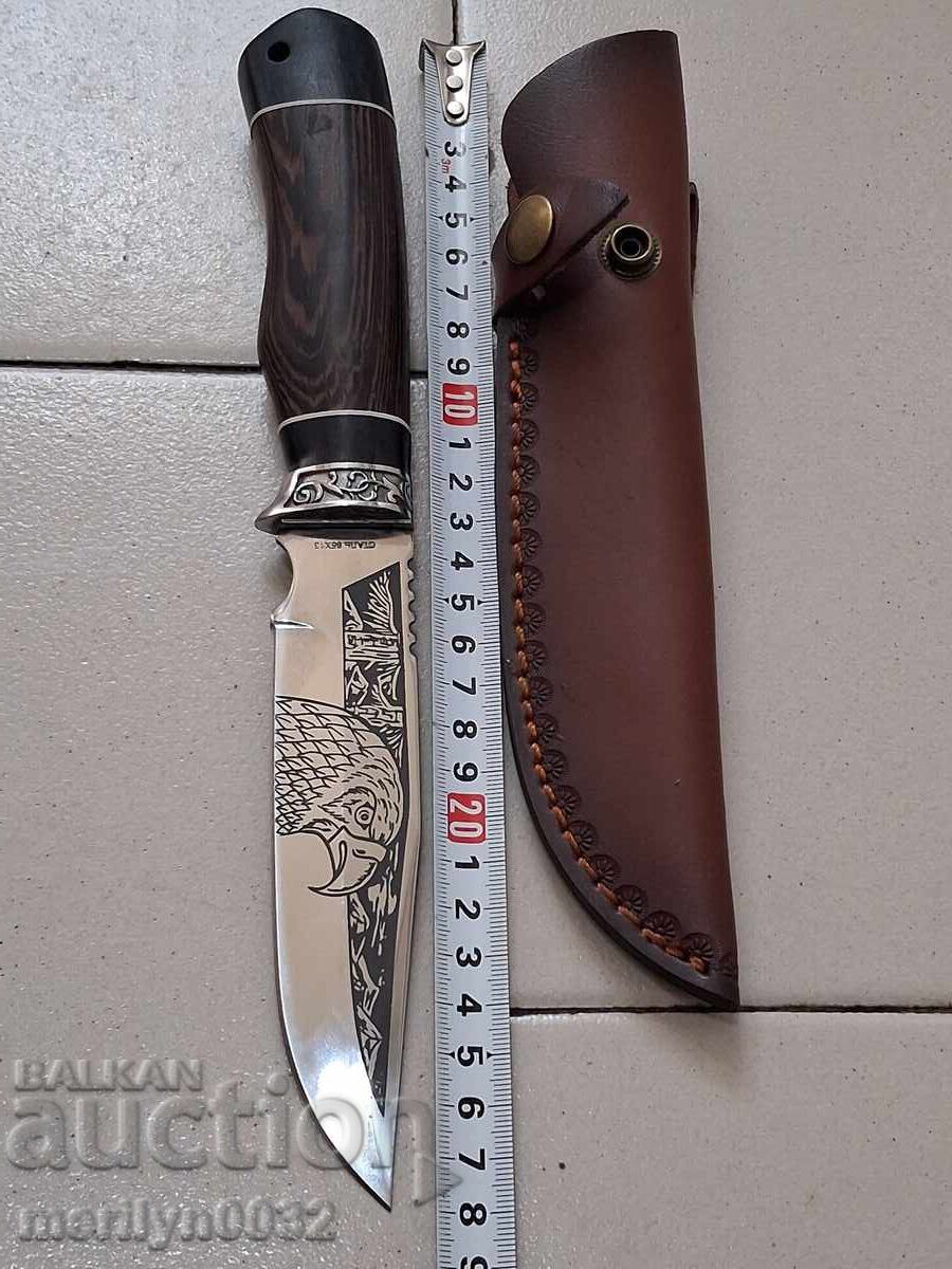 Hunting knife with sheath and engravings