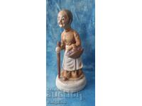 VINTAGE BISQUE FIGURINE - FLOWER GIRL