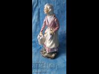 VINTAGE PORCELAIN FIGURINE - FISH SELLER