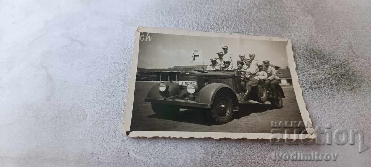 Photo Officers and soldiers with a vintage military vehicle 1938