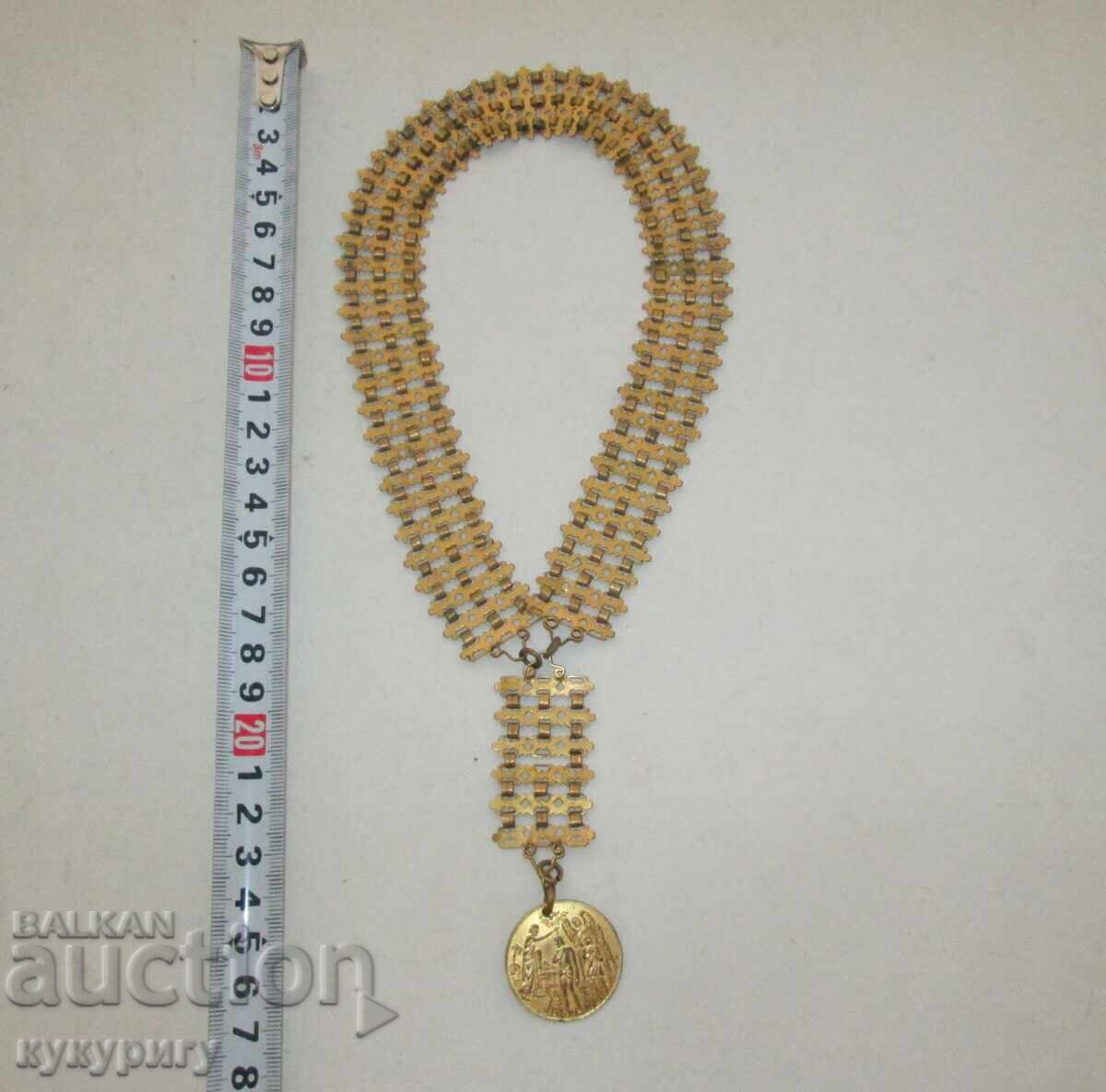 Delivery of Vintage gold-plated jewelry cord necklace with a coin pendant for baptism