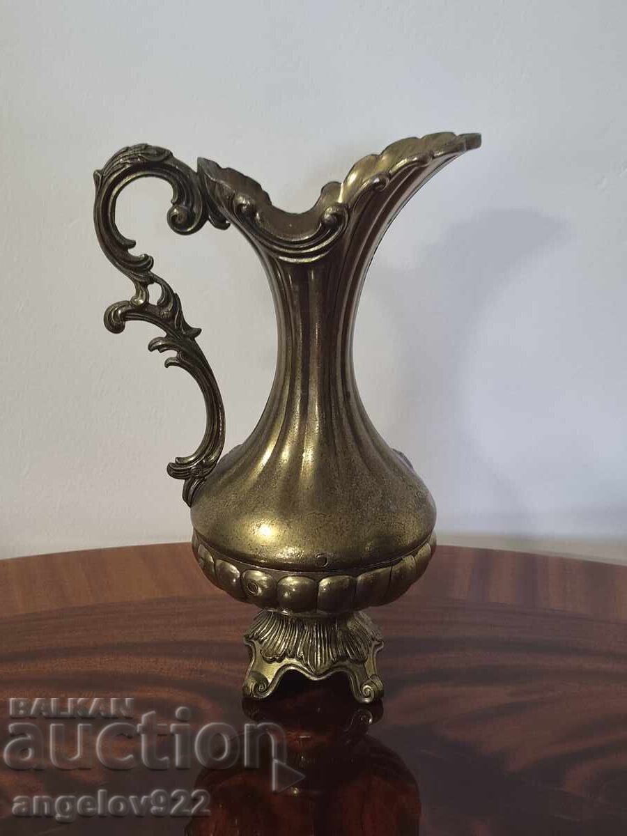 Delivery of Vintage metal pitcher with embossed floral motifs!!!