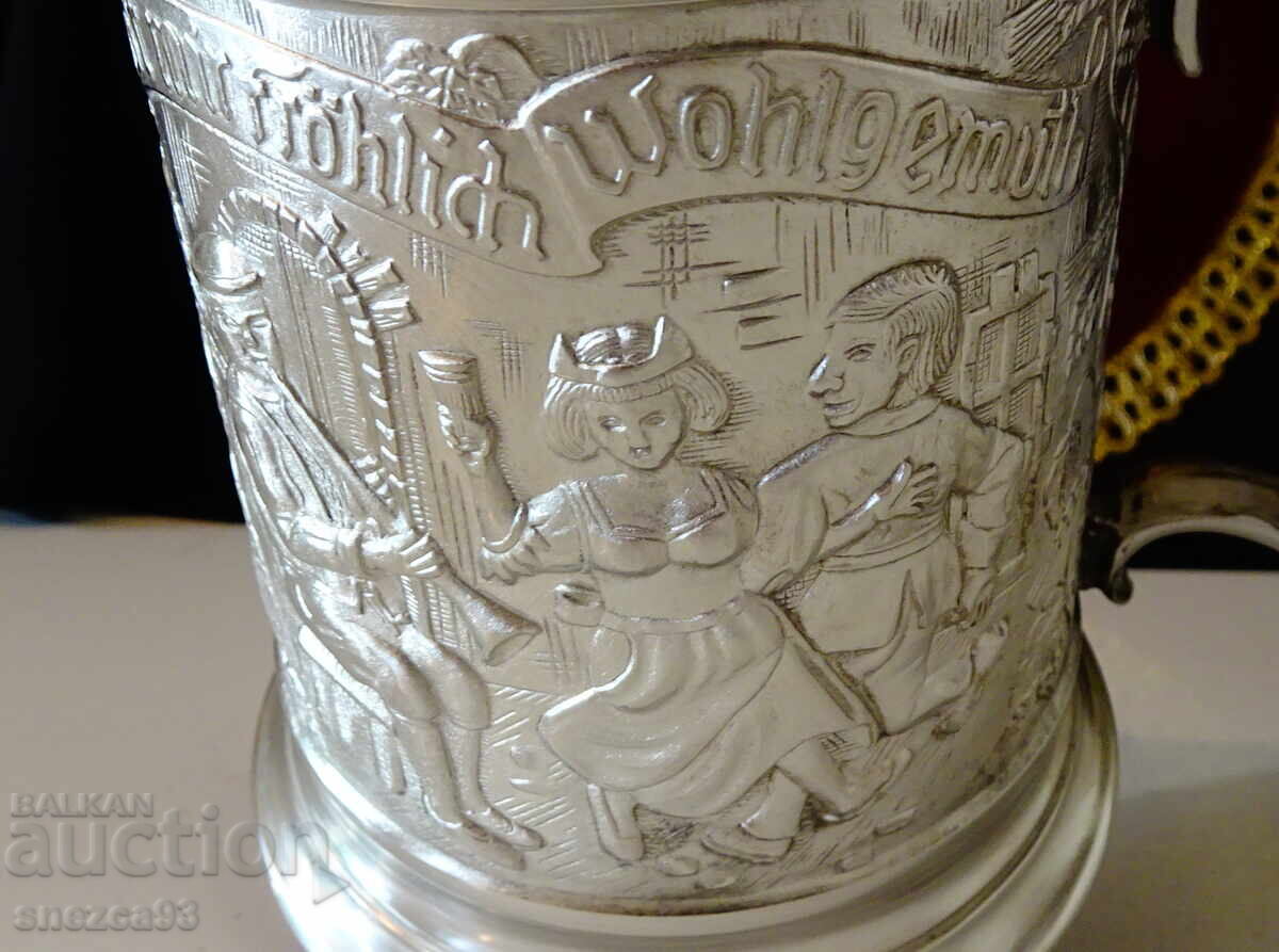 Auction  Pewter mug with embossed wedding scene 740 g