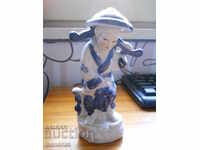 Porcelain figurine - fisherman (China)