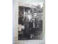 Photo of mother and son in the yard old