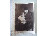 Old photo of a grandfather with a grandchild