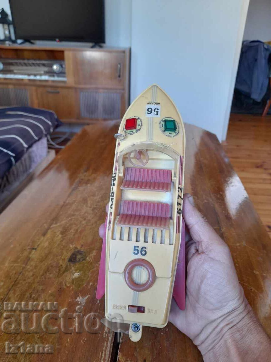 Delivery of Old toy boat, speedboat