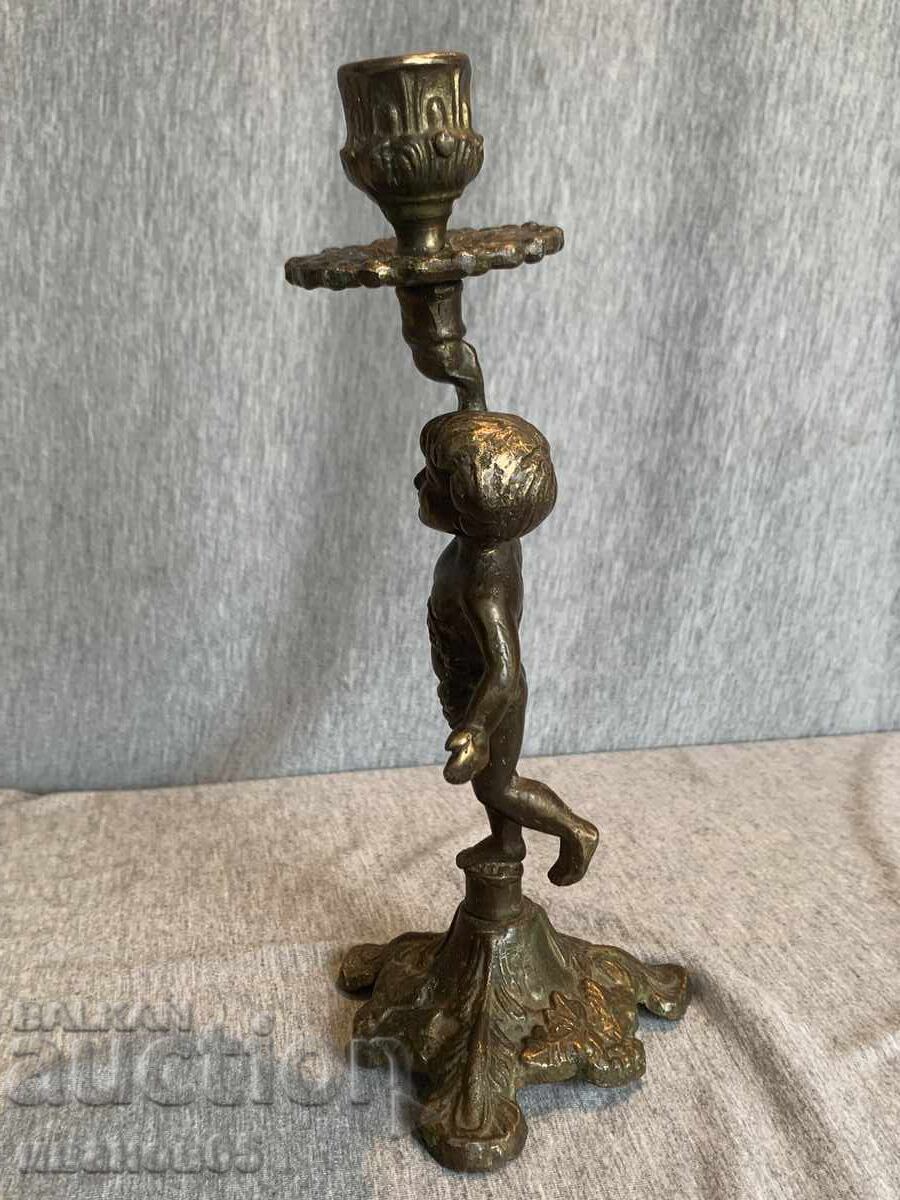 Delivery of Brass candlestick holder for a candle with an angel Delivery of Brass candlestick holder for a candle with an angel