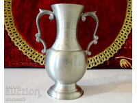 Pewter pitcher, vase, candlestick