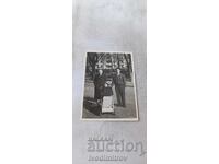 Photo Sofia Two men and a little girl with a vintage baby carriage