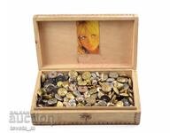 Wooden box filled with military buttons