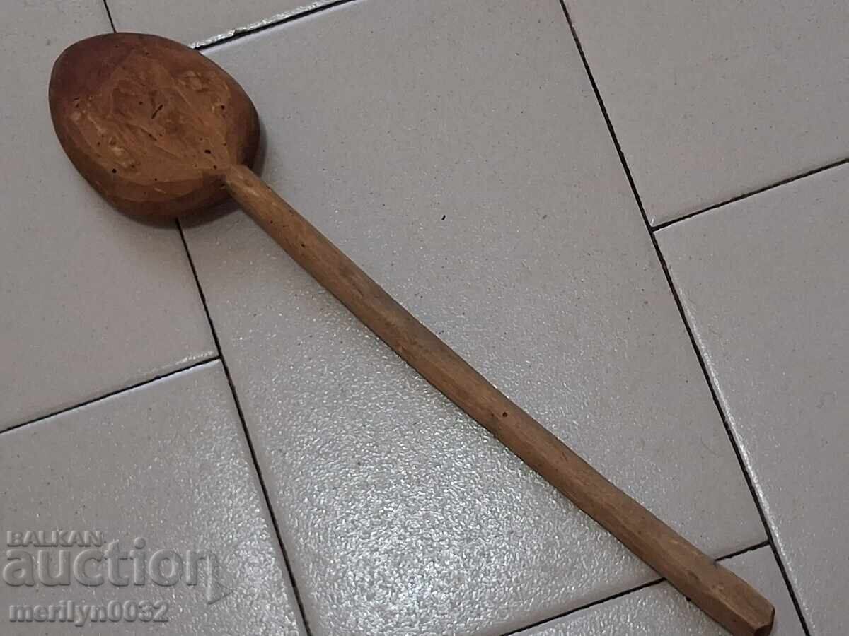 Delivery of Very old wooden spoon, ladle, wooden