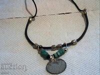 Old silver-plated coin and others with natural stones