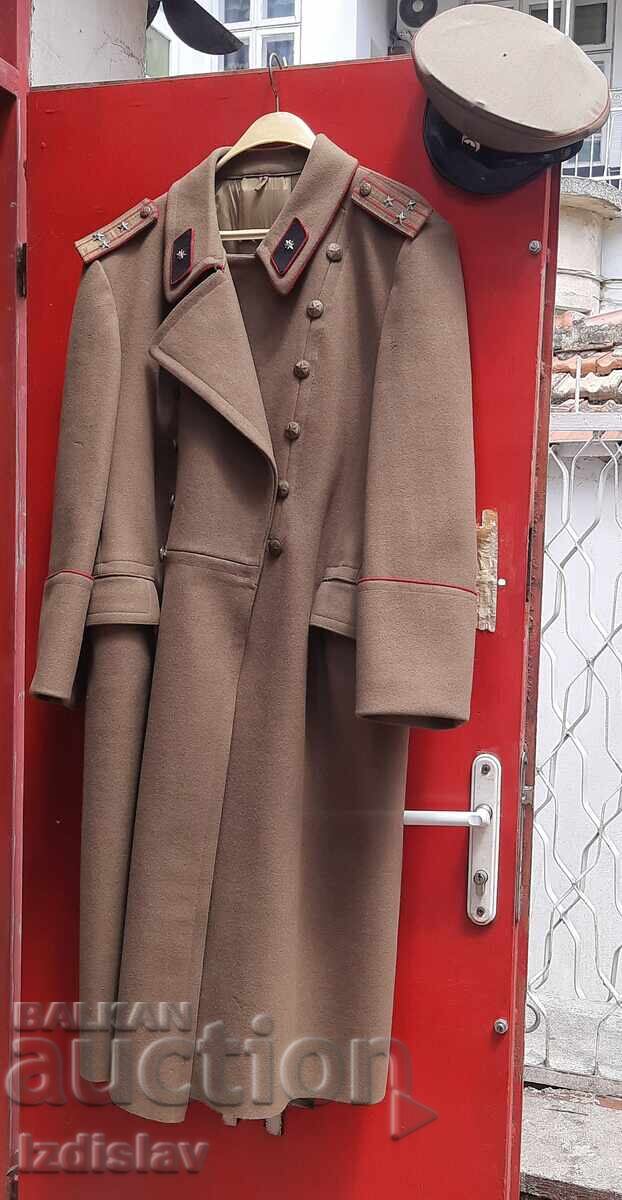 Socialist-era officer's greatcoat and signal corps peaked cap