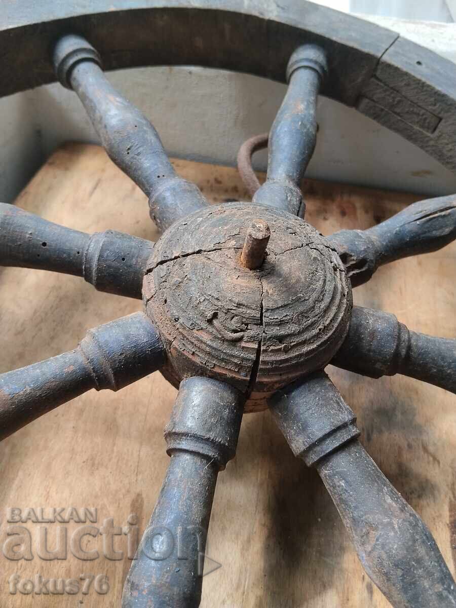 Delivery of Old wooden wheel with a crank - primitive antique