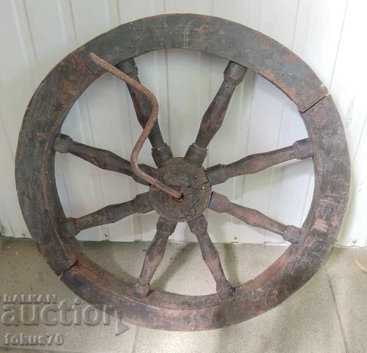 Old wooden wheel with a crank - primitive antique