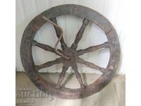 Old wooden wheel with a crank - primitive antique