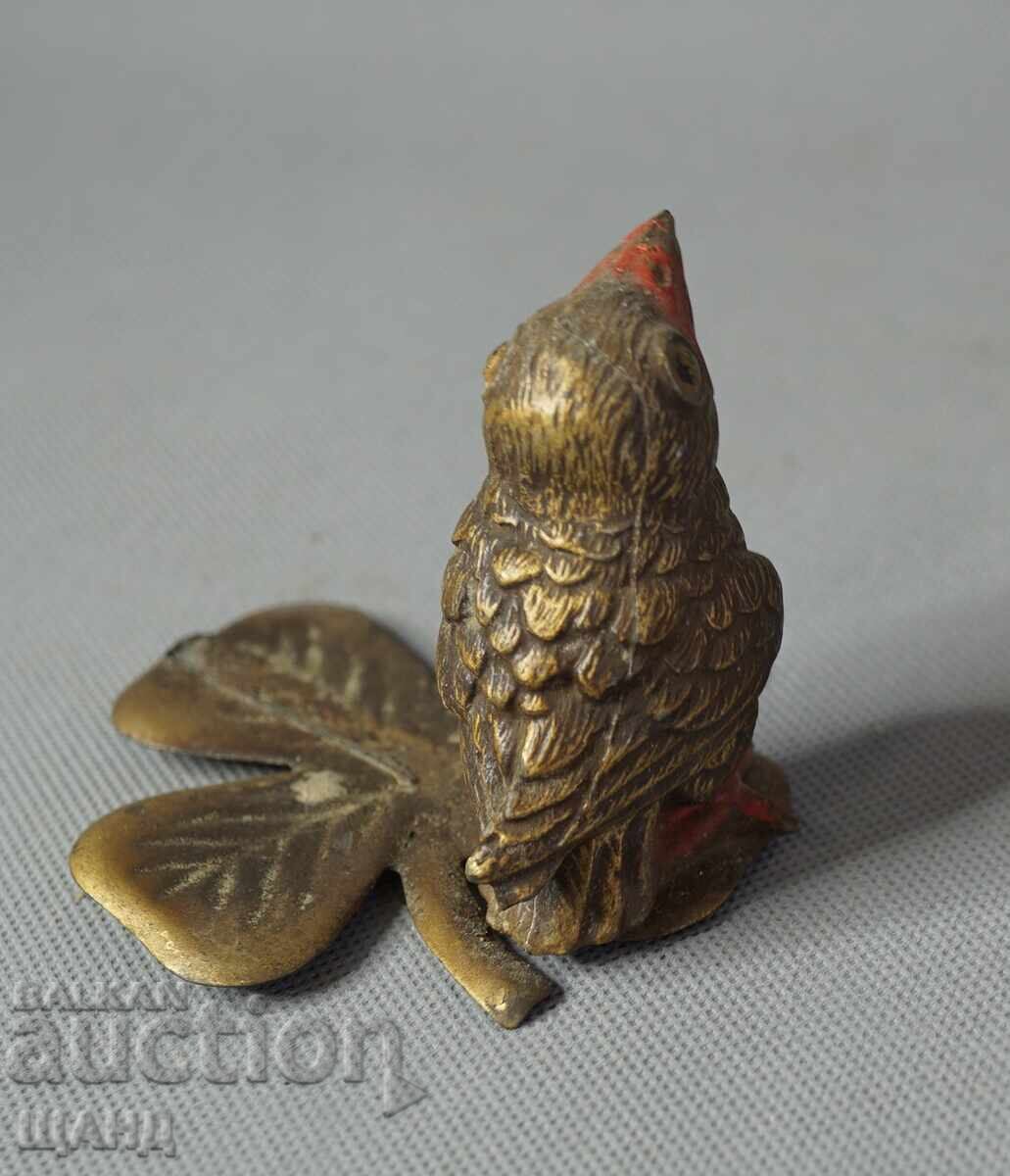 Delivery of Vintage metal bird figurine on a leaf