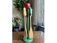 Vintage wooden kitchen utensil set on a stand