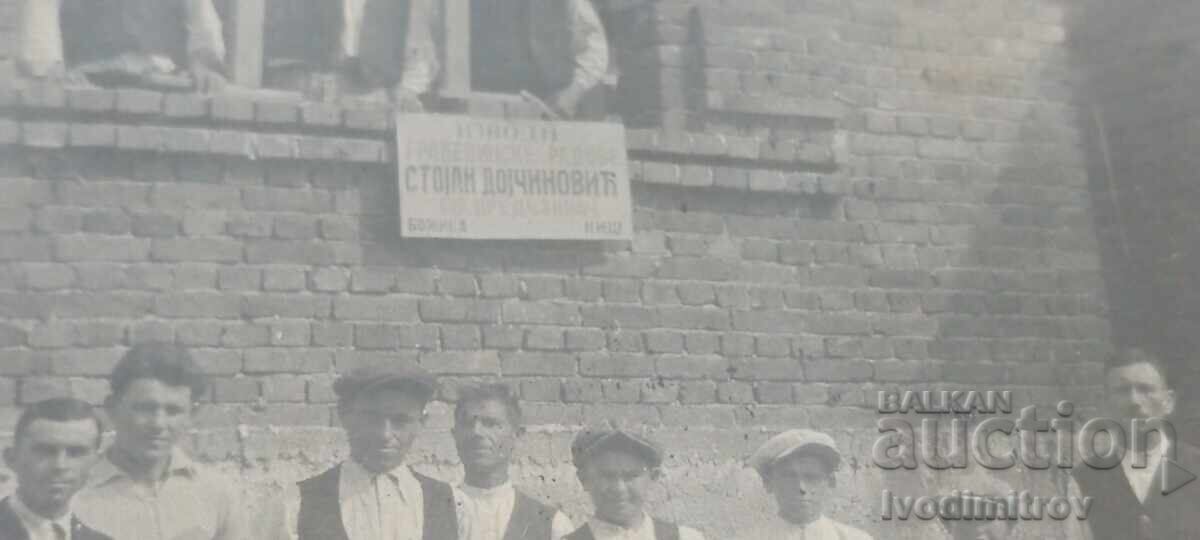 Photograph of men and boys in front of a house under construction with price € 3.43 | 6.71 BGN Photograph of men and boys in front of a house under construction with price € 3.43 | 6.71 BGN