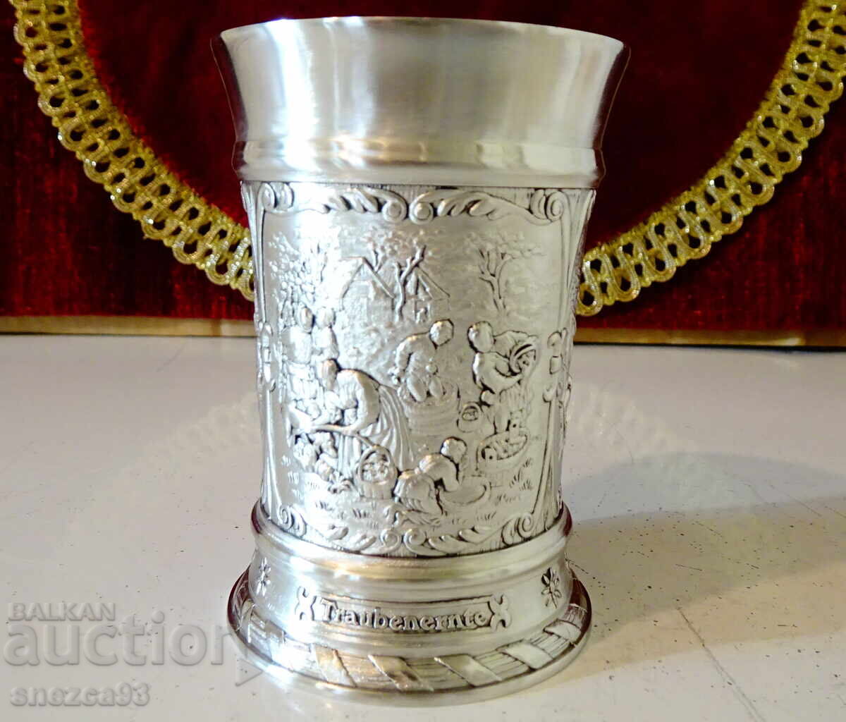 Auction  Pewter mug with colorful village scenes
