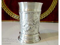 Pewter mug with colorful village scenes