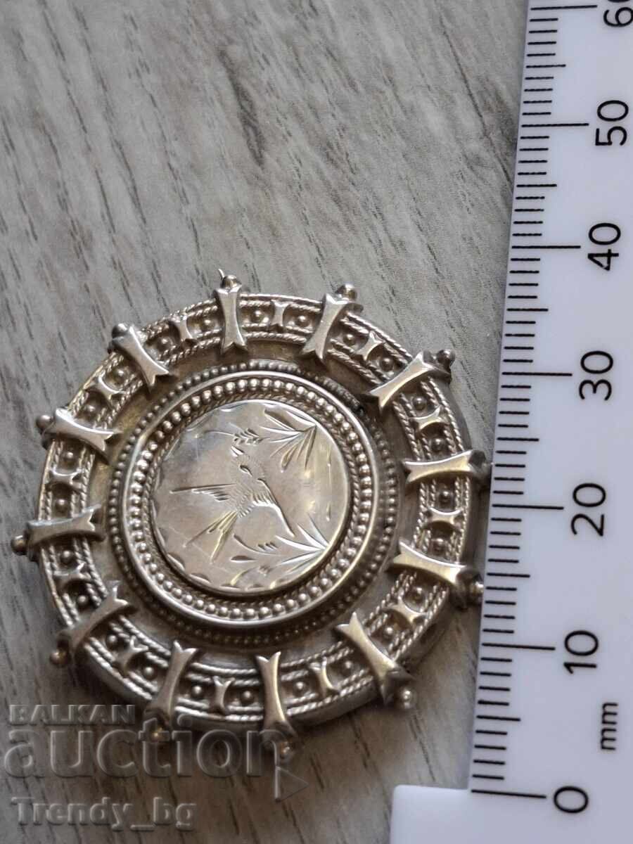 Auction  English silver locket-brooch with a secret compartment, 1909