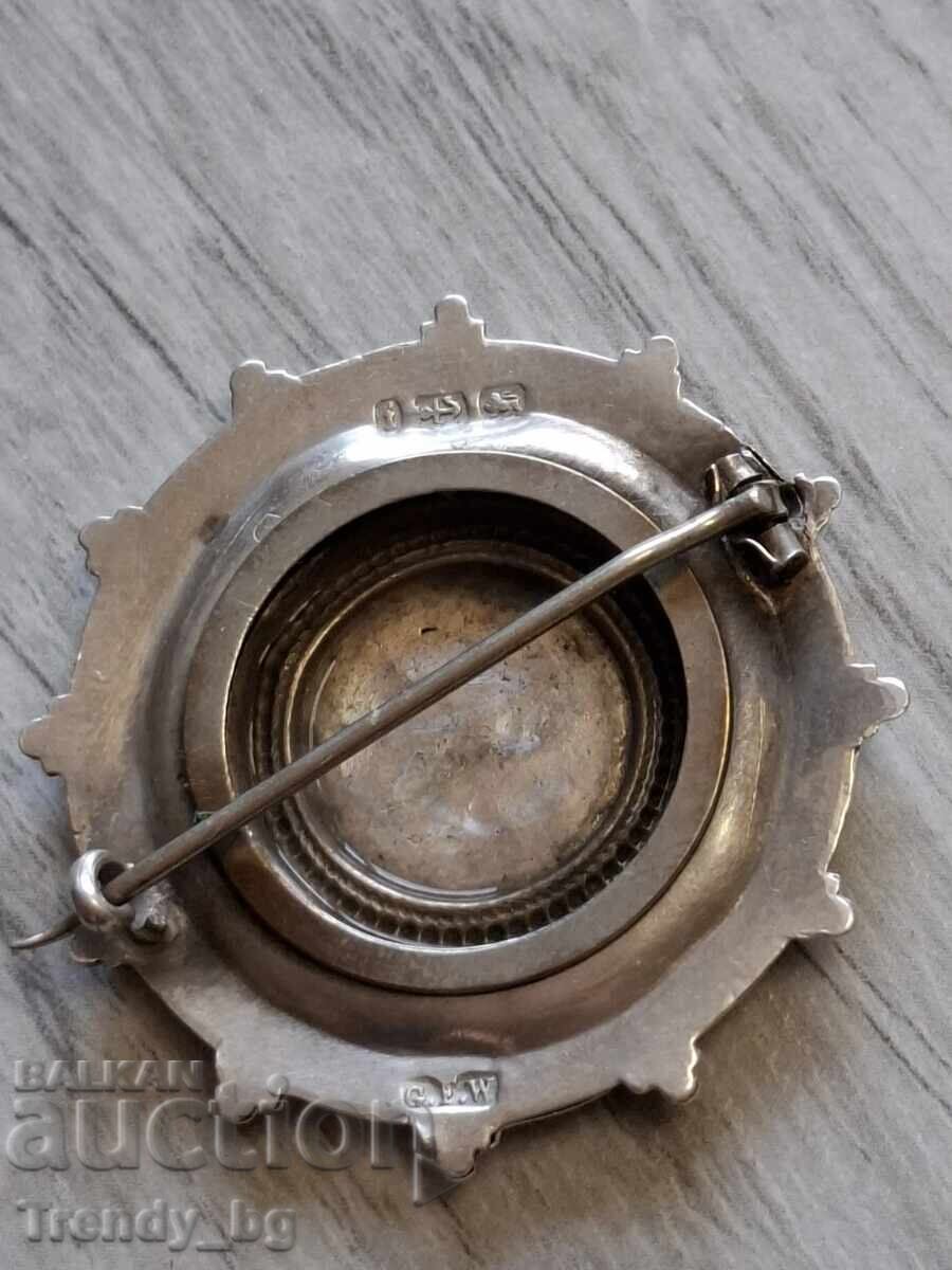 Delivery of English silver locket-brooch with a secret compartment, 1909
