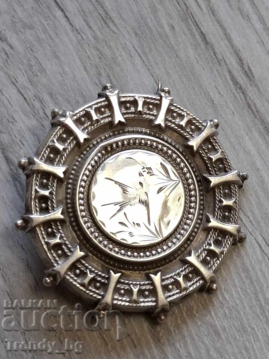 English silver locket-brooch with a secret compartment, 1909